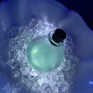 a blue bowl filled with ice