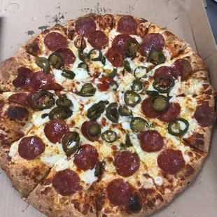 Large pepperoni and jalapeño pizza