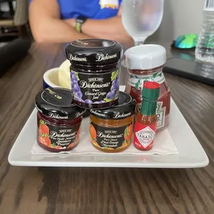 a plate of jams and condiments