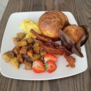 2 Eggs Breakfast with Bacon, potatoes, fresh strawberries and Croissant plus blueberry muffin