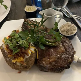 Prime rib with baked potato and asparagus