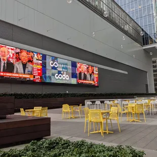 Outside on Coda&apos;s beautiful patio. Plenty of seating outside the Collective (what they call the food court / food hall here).