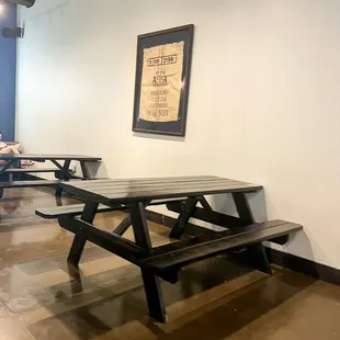 a table and benches in a coffee shop