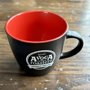 a black and red mug