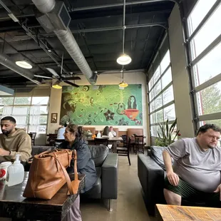 a group of people sitting in a coffee shop