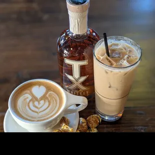 a cup of coffee and a bottle of liquor