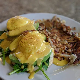Avocado Benedict (Poached eggs, toasted english muffin, avocado, tomatoes, spinach, hollandaise sauce, and hash browns) ThatsDelishIsh.com