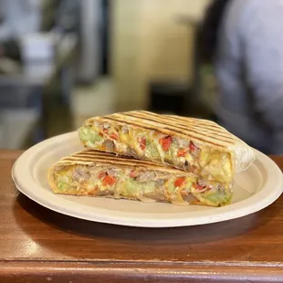 Breakfast Crunchwrap w/ sausage, roasted red peppers, avocado &amp; onions added