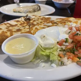 Steak quesadilla forefront and side order of chili releno