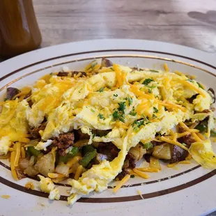 Texas Skillet! Under the eggs were potatoes, onions, peppers, jalapeños and chorizo!
