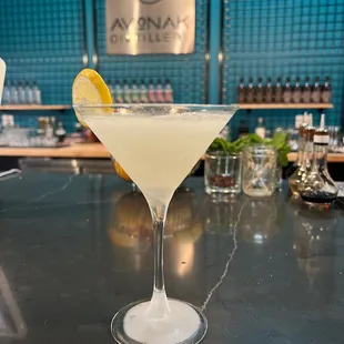 a martini with a lemon wedge in it