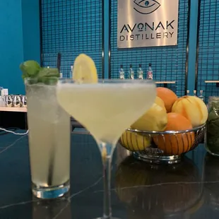 two cocktails on a bar