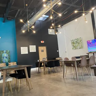 a dining area with tables and chairs