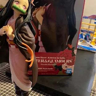 Gorgeous Nezuko figure among so many others I have from the shop!