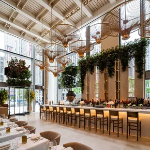 a long dining table with white linens