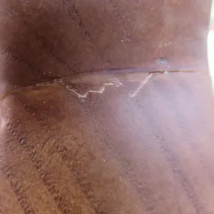 The chair had a veneer and was not solid wood under finish