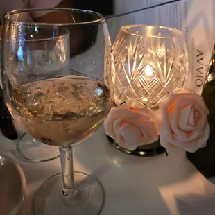 a glass of wine and a bottle of wine