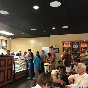 a group of people in a coffee shop