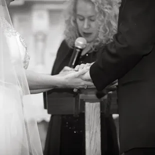 Wedding Ceremony Officiant, Rev. Andrea Archuleta, blesses the marriage vows.