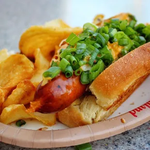 Beer Cheese Dog - $9.79. Kielbasa sausage in a toasted potato bun topped with beer cheese, sauerkraut and green onions. [07/2019]