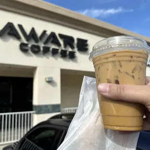 Iced bourbon vanilla latte w/ decaf &amp; oatmilk. Also some mochi donuts