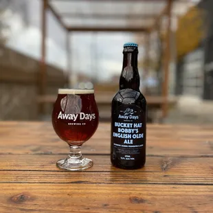 a glass of beer and a bottle of beer