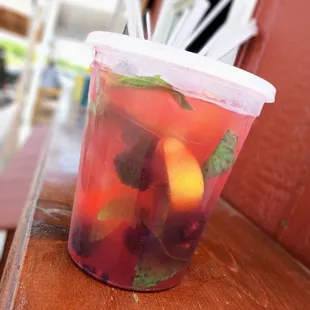 a plastic cup filled with fruit