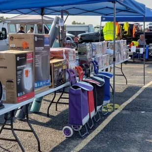 a variety of items under a blue tent
