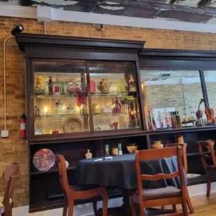a dining area with tables and chairs