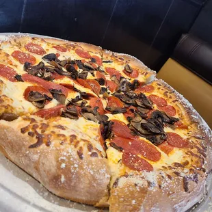 Pepperoni &amp; mushroom pizza w/ light sauce. Very tasty! Does not reheat well fyi. Eat it fresh