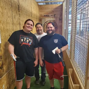 Look at these happy guys loving the axe throwing.