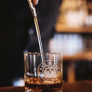 a person pouring a drink