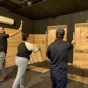 The instructor was in the middle giving instructions on how to throw different ways