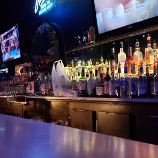 a bar filled with liquor bottles
