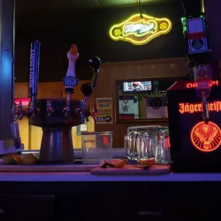 a bar with neon signs