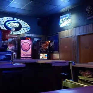 a bar with neon signs