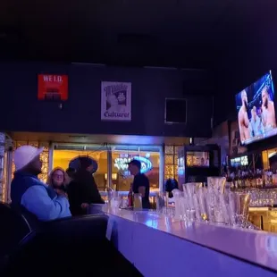 people sitting at the bar