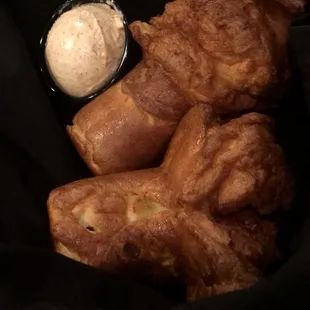 a basket of croissants and dip