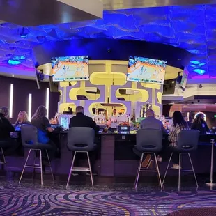 people sitting at the bar