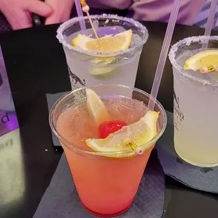 three cocktails on a table