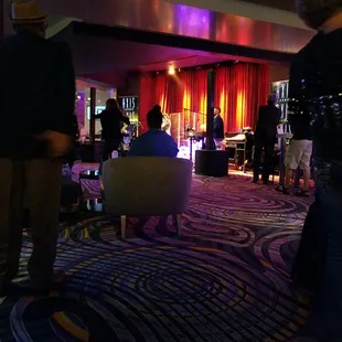 a group of people in a lounge area