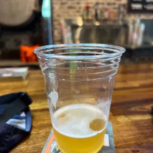 a glass of beer on a table