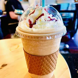 an ice cream sundae in a plastic cup