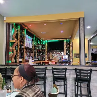 a woman sitting at the bar