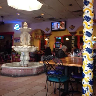 a fountain and tables