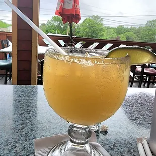 a glass of orange juice on a table