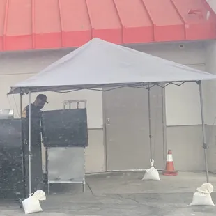 Guy grilling outside