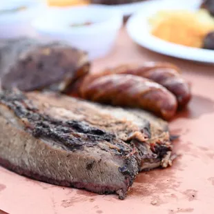 a plate of meat and sausages