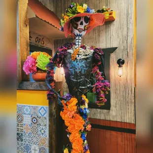 a skeleton dressed in a mexican costume