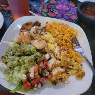 Pollo a la Pina, (grilled chicken, grilled shrimp) rice, guacamole salad, Pico, grilled pineapple and cheese sauce.